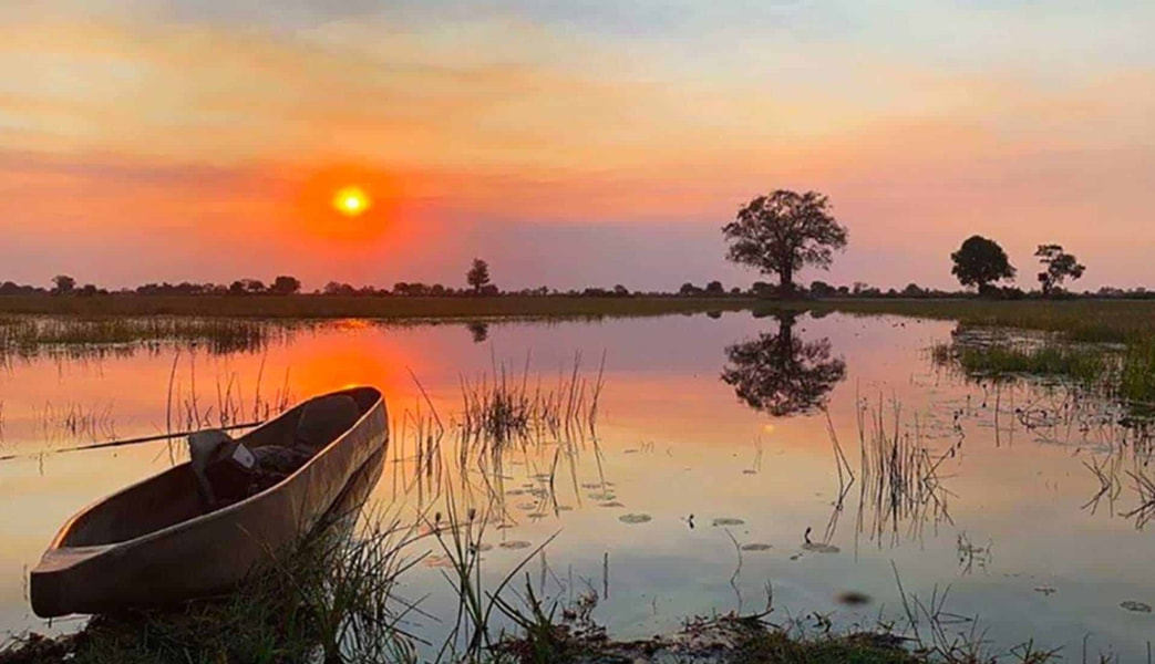 Mokoro at sunset, Okavango Delta, Botswana